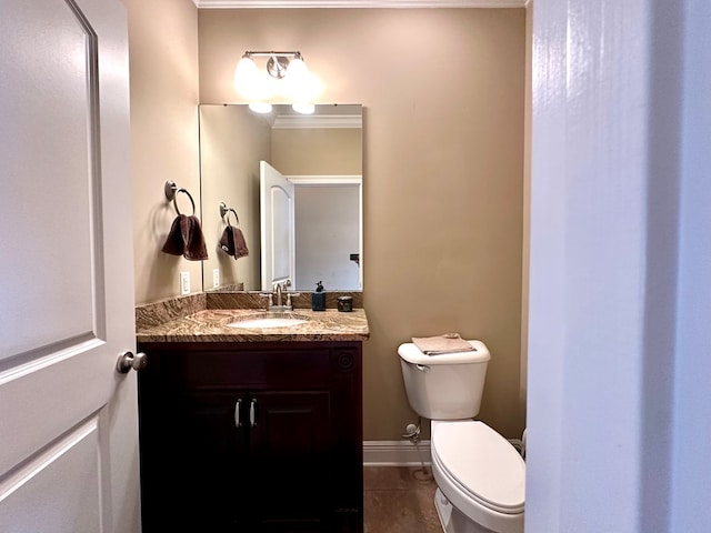 202 Frisco Ln, Enterprise, AL 36330 - bathroom with tile patterned floors, baseboards, vanity, and toilet