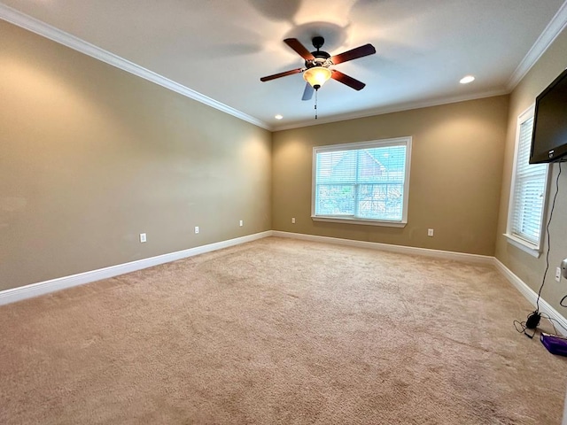 202 Frisco Ln, Enterprise, AL 36330 - empty room with crown molding, baseboards, a ceiling fan, and light colored carpet