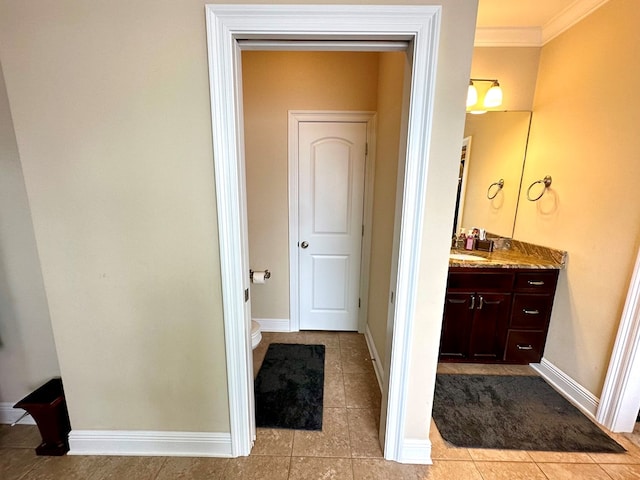 202 Frisco Ln, Enterprise, AL 36330 - bathroom featuring tile patterned flooring, ornamental molding, baseboards, and vanity