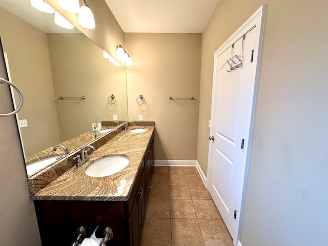 202 Frisco Ln, Enterprise, AL 36330 - bathroom with double vanity, a sink, and tile patterned floors