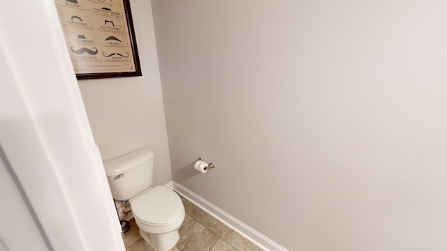 bathroom with tile patterned floors and toilet