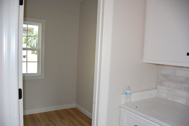 110 Mikala Ct, Enterprise, AL 36330 - bathroom with wood finished floors and decorative backsplash