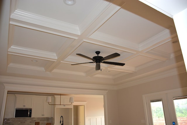 110 Mikala Ct, Enterprise, AL 36330 - detailed view of coffered ceiling, stainless steel microwave, ornamental molding, beam ceiling, and a ceiling fan