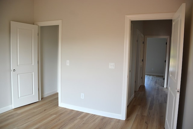 110 Mikala Ct, Enterprise, AL 36330 - unfurnished bedroom with light wood-style floors and baseboards
