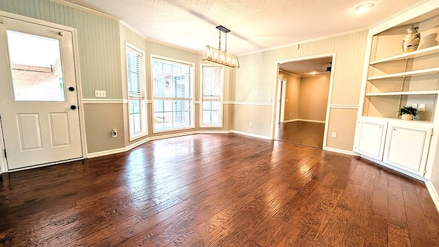 5 Walford Pl, Dothan, AL 36301 - unfurnished dining area with ornamental molding, dark wood finished floors, a textured ceiling, and built in features