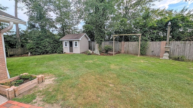 5 Walford Pl, Dothan, AL 36301 - fenced backyard featuring a vegetable garden and a storage unit