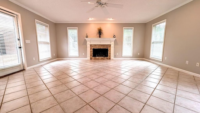 5 Walford Pl, Dothan, AL 36301 - unfurnished living room featuring ceiling fan, light tile patterned flooring, ornamental molding, a brick fireplace, and a textured ceiling