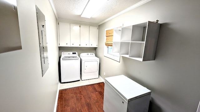 5 Walford Pl, Dothan, AL 36301 - washroom featuring cabinet space, separate washer and dryer, a textured ceiling, dark wood-style floors, and ornamental molding