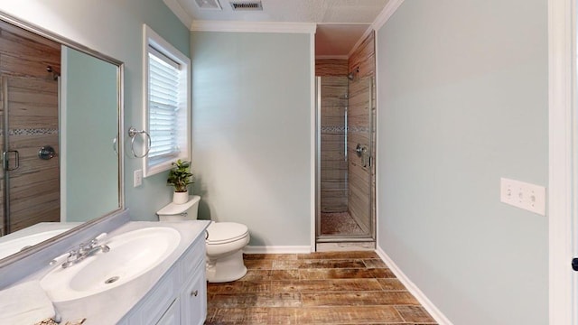 5 Walford Pl, Dothan, AL 36301 - bathroom with vanity, a stall shower, ornamental molding, and wood finished floors