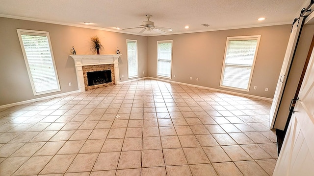 5 Walford Pl, Dothan, AL 36301 - unfurnished living room with crown molding, light tile patterned floors, a ceiling fan, a textured ceiling, and a brick fireplace
