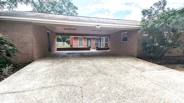 5 Walford Pl, Dothan, AL 36301 - view of property exterior featuring brick siding, driveway, and a carport