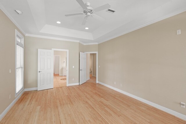 707 Edinburgh Way, Dothan, AL 36305 - unfurnished bedroom featuring visible vents, baseboards, light wood finished floors, a tray ceiling, and recessed lighting