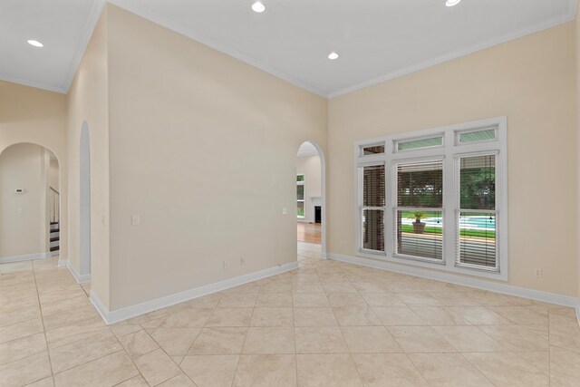 707 Edinburgh Way, Dothan, AL 36305 - unfurnished room featuring light tile patterned floors, arched walkways, and ornamental molding