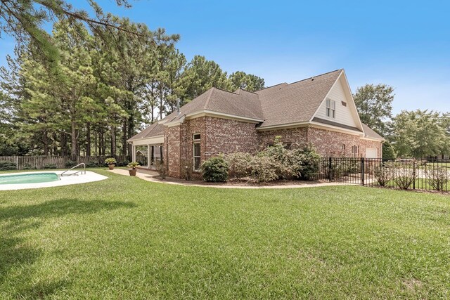 707 Edinburgh Way, Dothan, AL 36305 - view of side of property featuring brick siding, a yard, and fence private yard