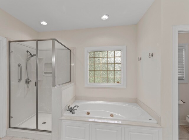 707 Edinburgh Way, Dothan, AL 36305 - bathroom featuring recessed lighting, a shower stall, a tub with jets, and toilet