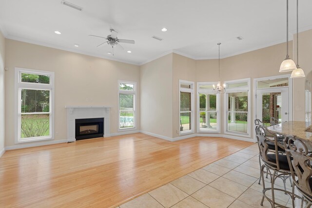 707 Edinburgh Way, Dothan, AL 36305 - living room with visible vents, a fireplace, light wood-type flooring, ceiling fan with notable chandelier, and recessed lighting