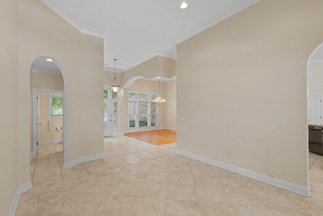 707 Edinburgh Way, Dothan, AL 36305 - unfurnished room featuring crown molding, arched walkways, baseboards, and light tile patterned floors