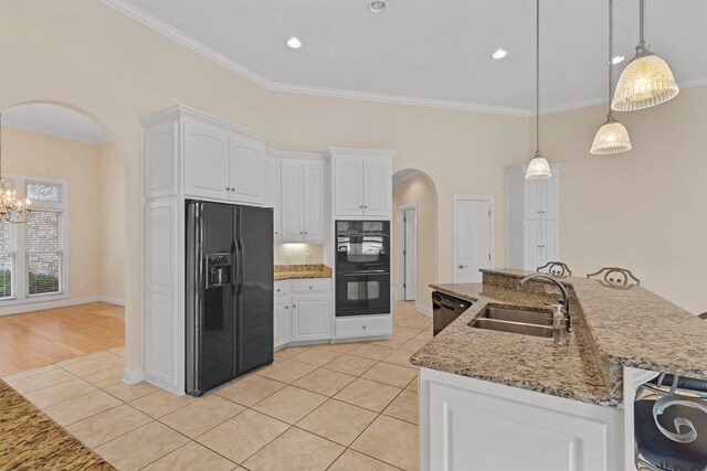 707 Edinburgh Way, Dothan, AL 36305 - kitchen with crown molding, a sink, arched walkways, light tile patterned floors, and black appliances