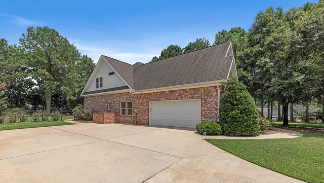 707 Edinburgh Way, Dothan, AL 36305 - view of property exterior with a garage, a yard, concrete driveway, and brick siding