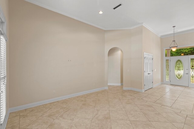 707 Edinburgh Way, Dothan, AL 36305 - foyer entrance with arched walkways, light tile patterned floors, baseboards, ornamental molding, and recessed lighting
