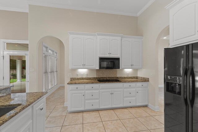 707 Edinburgh Way, Dothan, AL 36305 - kitchen featuring arched walkways, white cabinets, stone countertops, and black appliances