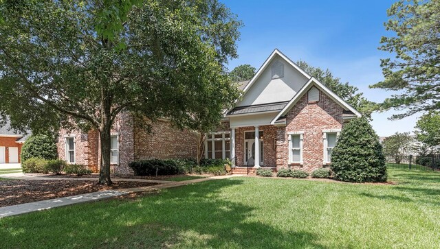 707 Edinburgh Way, Dothan, AL 36305 - view of front of property with brick siding, fence, and a front yard