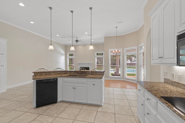 707 Edinburgh Way, Dothan, AL 36305 - kitchen featuring a sink, a fireplace, ceiling fan with notable chandelier, light tile patterned floors, and black appliances