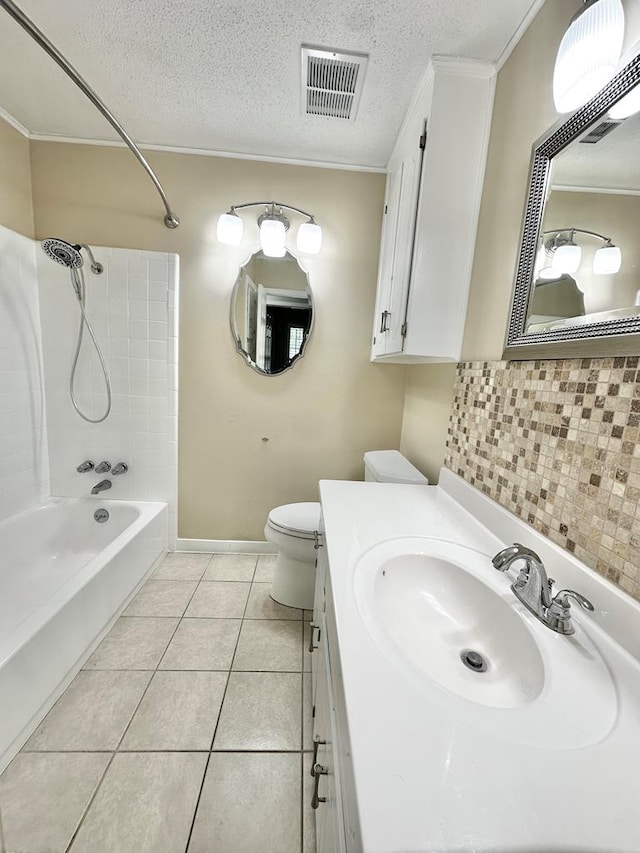 1006 Northfield Cir, Dothan, AL 36301 - full bath with shower / washtub combination, tasteful backsplash, tile patterned flooring, toilet, and a textured ceiling