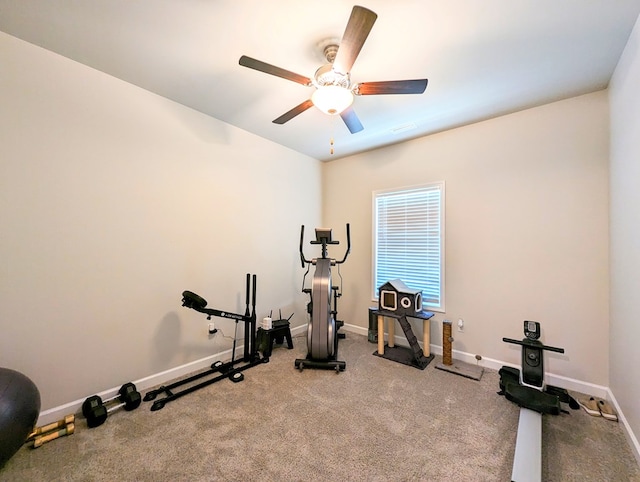 exercise room featuring light colored carpet and ceiling fan