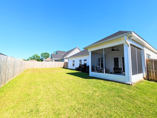 view of yard featuring a sunroom