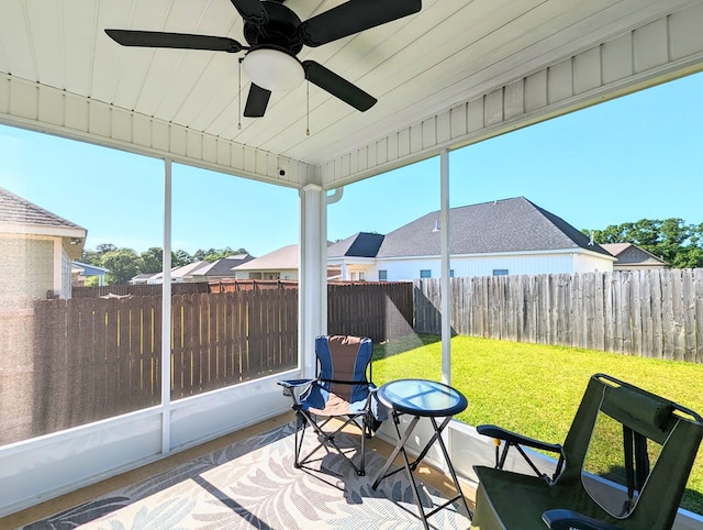 sunroom / solarium with ceiling fan and a healthy amount of sunlight