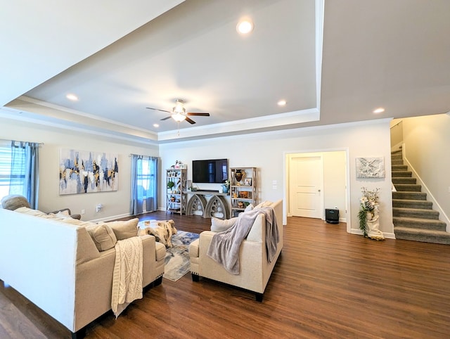 living room featuring dark hardwood / wood-style flooring and a healthy amount of sunlight