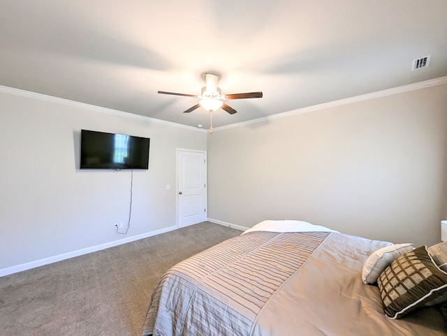 bedroom featuring carpet, ceiling fan, and crown molding