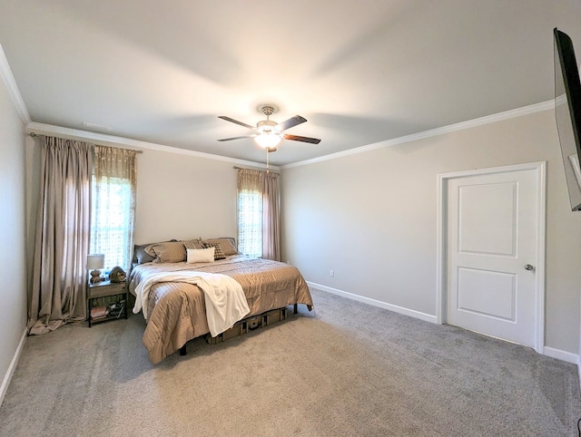 carpeted bedroom featuring multiple windows, ceiling fan, and ornamental molding