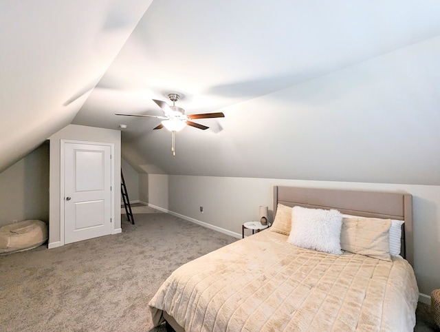 carpeted bedroom with ceiling fan and lofted ceiling