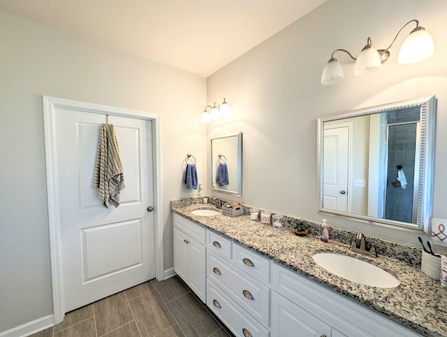 bathroom with vanity and an enclosed shower