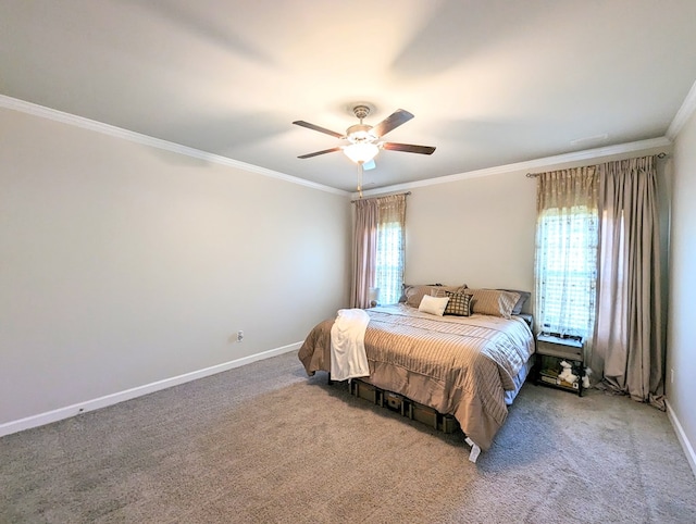 carpeted bedroom with ceiling fan and crown molding