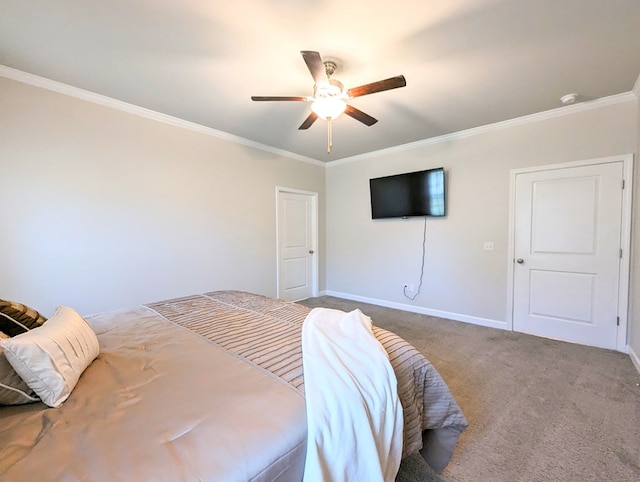 bedroom with carpet floors, ceiling fan, and crown molding