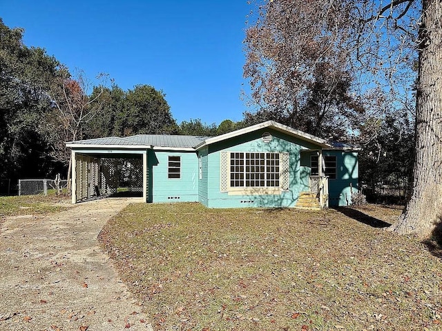 view of front of property with a carport