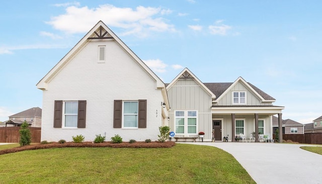 view of front of home featuring a front lawn and covered porch