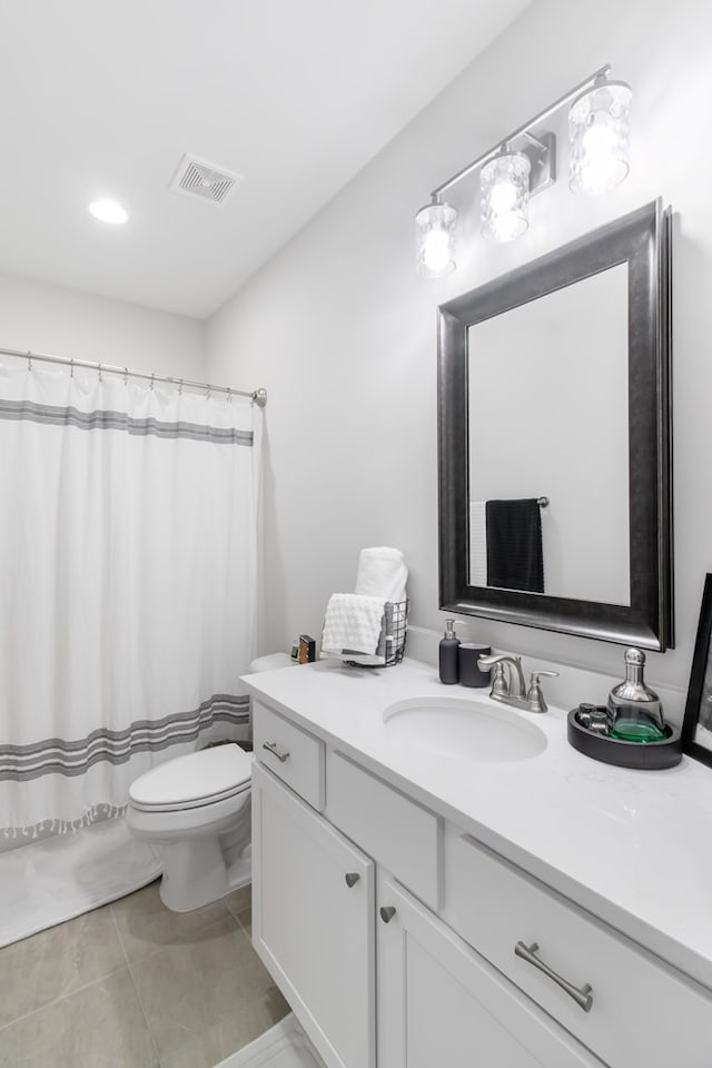 bathroom featuring tile patterned floors, vanity, toilet, and a shower with shower curtain