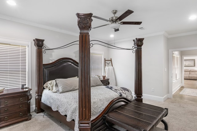 carpeted bedroom with ceiling fan, ornamental molding, and ornate columns