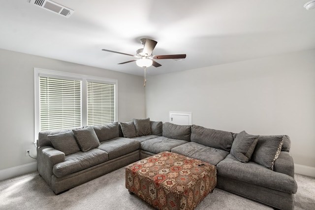 living room featuring light colored carpet and ceiling fan