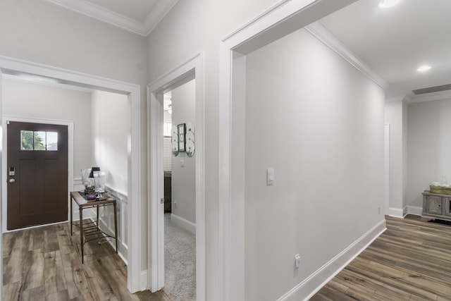 foyer featuring dark wood-type flooring and ornamental molding