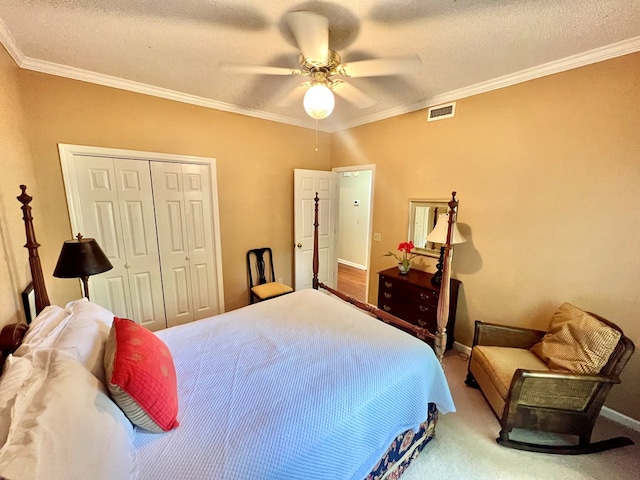 508 N Englewood Ave, Dothan, AL 36303 - bedroom featuring crown molding, a closet, a textured ceiling, carpet floors, and ceiling fan