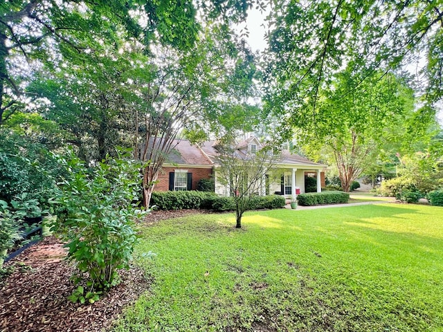 508 N Englewood Ave, Dothan, AL 36303 - obstructed view of property featuring a front yard and brick siding