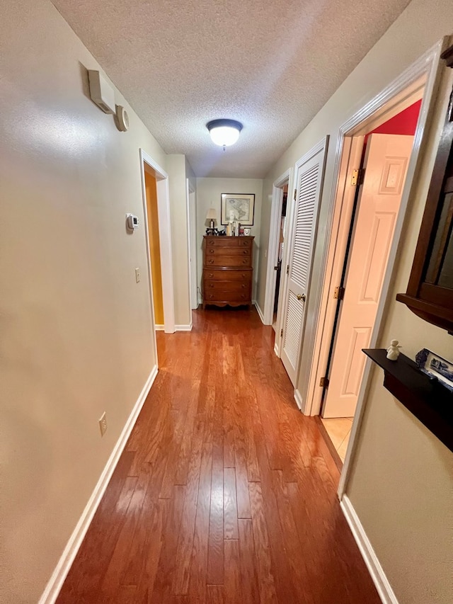 508 N Englewood Ave, Dothan, AL 36303 - hallway with light wood finished floors and a textured ceiling