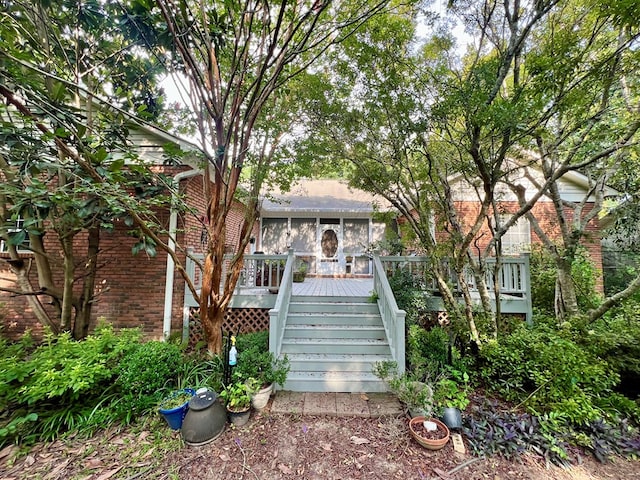 508 N Englewood Ave, Dothan, AL 36303 - view of front facade featuring brick siding, stairs, and a wooden deck