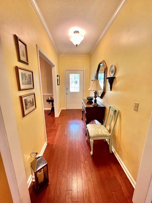 508 N Englewood Ave, Dothan, AL 36303 - doorway to outside with dark wood finished floors, a textured ceiling, and ornamental molding