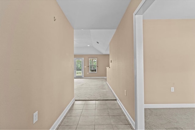 4808 Crystal Springs Rd, Red Level, AL 36474 - corridor with lofted ceiling, baseboards, light tile patterned floors, and light colored carpet